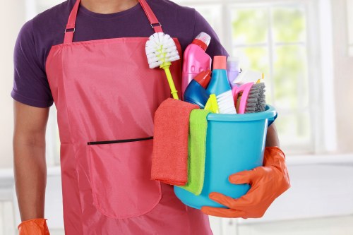 Cleaner washing residential windows in Greenwich